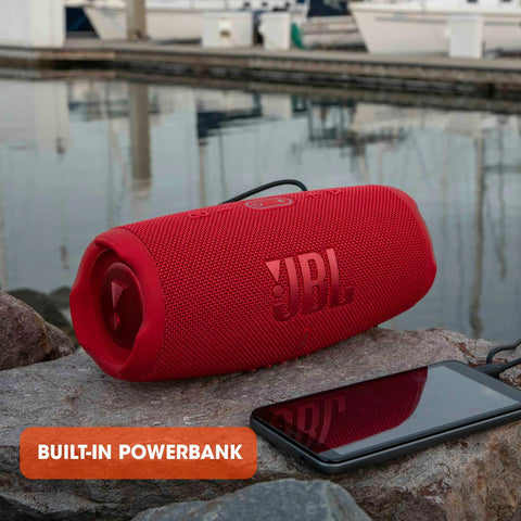Charge 5 Portable Waterproof Bluetooth Speaker With USB Power Bank Output 20 Hours Play Time IP67 Beast Mode on rocks with phone