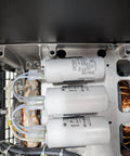 Rock Solid Pto Generator Package Serving A Knockout 16 Kilowatt Single Phase Setup Built Different With Aluminum And Steel Delivering Smooth 120V And 240V Power Straight To Tractor Mounts Runs Clean With Copper Windings And Zero Hassle Maintenance For close-up of capacitors and copper windings in generator.