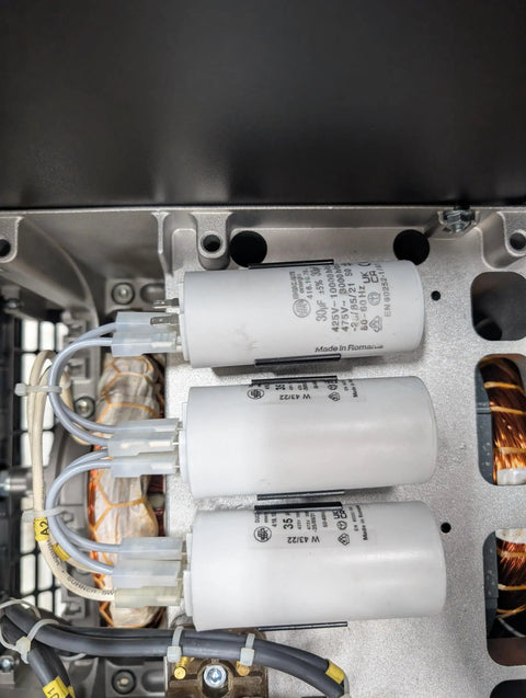 Rock Solid Pto Generator Package Serving A Knockout 16 Kilowatt Single Phase Setup Built Different With Aluminum And Steel Delivering Smooth 120V And 240V Power Straight To Tractor Mounts Runs Clean With Copper Windings And Zero Hassle Maintenance For close-up of capacitors and copper windings in generator.