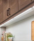 Kitchen view with 4U Series 30 Inch LED Under Cabinet Light 120V White 3000K Diffused Task Lighting, slim design under wood cabinets.