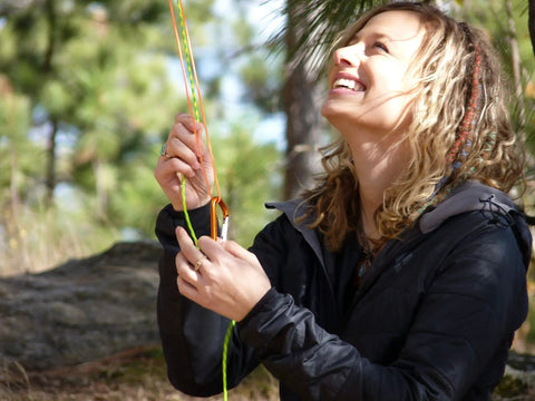 Person using Bear Bag Food Hanging System For Camping And Hiking With 2 To 1 Pulley waterproof ropes outdoors