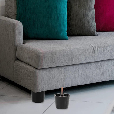 4 Pack Adjustable Furniture Levelers Screw On Feet for Cabinets And Tables 50mm Tall Plastic And Iron Legs in use under a sofa