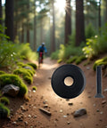 Black Front Fork Stem Top Cap And Screw for one and one eighth inch road bike stems on forest trail background