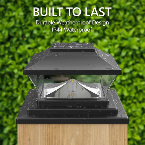 Solar Outdoor Post Cap Lights For 4x4 5x5 And 6x6 Posts, Bright Warm White LEDs, Auto On At Dusk, Slate Black cap on wooden post