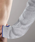 Tough As Nails Cut Resistant Arm Sleeve With Snug Elastic Fit For Men And Women Breathable Forearm Guard for industrial work, gray fabric.