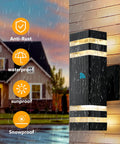 Exterior Dusk to Dawn LED Wall Sconces Two Pack Up and Down Modern Black Outdoor Porch Lights illuminated in rain