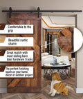 10 Inch Round Rustic Barn Door Handle In Black Steel Versatile Pull For Sliding Doors Gates Garages Sheds Fences Closets And Pantries Indoor And Outdoor Use With Easy Install Durable Black Powder Coated Finish For Weather Resistance And Smooth Operation installed on wooden barn door indoors with decorative room view