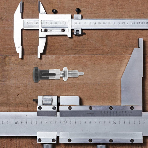 Heavy Duty Stainless Steel Spring Plunger Pin With Knurled Grip And Quick Release Pull Ring on caliper measuring tool.
