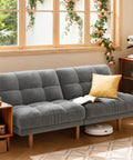65 Inch Convertible Futon Sofa Bed With Adjustable Backrest Corduroy Grey Upholstery in cozy living room setting