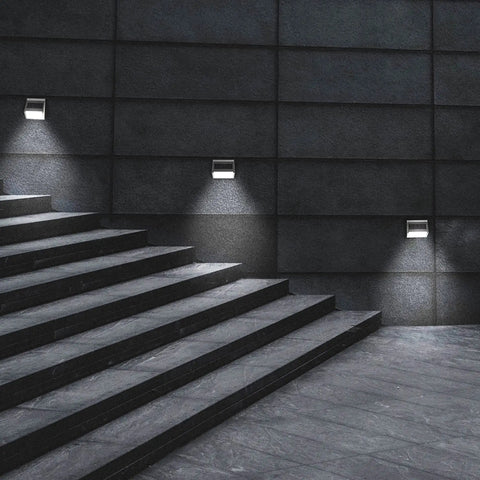 Upgrade Solar Step Lights 12 Pack Outdoor LED Deck Lights illuminating stairway with waterproof design, sleek black background.