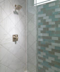 H2Okinetic Showerhead With WaterSense, 1.5 GPM At 80 Psi, Stainless Finish, mounted in a modern shower setting with spa spray