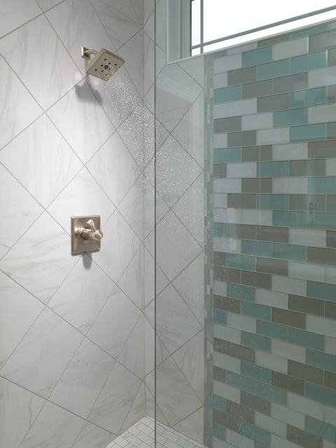 H2Okinetic Showerhead With WaterSense, 1.5 GPM At 80 Psi, Stainless Finish, mounted in a modern shower setting with spa spray