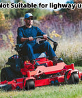 Man operating zero-turn mower with heavy duty 13x6.50-6 flat free lawn mower tires and wheels set on grass