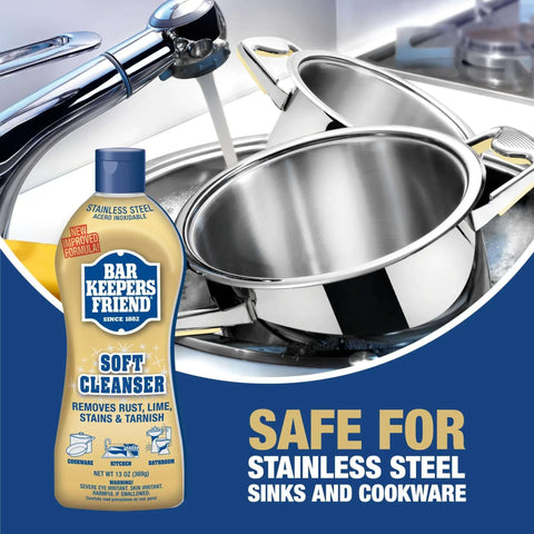 Soft Cleanser Liquid 2 Pack 13 Oz Bottles Multipurpose Cleaner and Rust Stain Remover for Stainless Steel Porcelain Ceramic Tile and More Tackle Grime Fast in Kitchen and Bath with stainless steel sink and cookware in background.