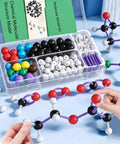 Hands assembling Organic Chemistry Molecular Structure Model Set With Ball And Stick And Space Filling Models VSEPR Models.