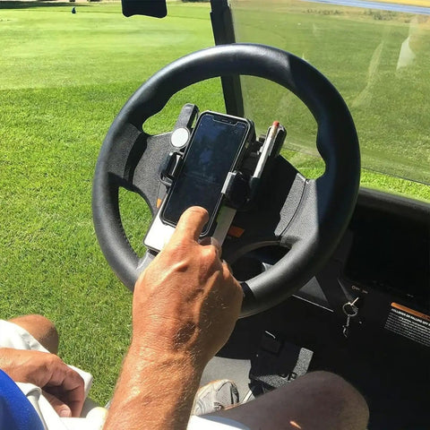 Hand using Golf Cart Steering Wheel Phone Holder With Flip Up Design And Scorecard Slot, 360 Degree Adjustable Anti Slip Smartphone Mount