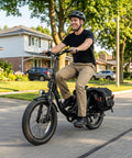 Man riding Foldable Electric Bike for Adults With 1200W Peak Motor, 20 Inch Fat Tires, 48V 13.5Ah Removable Battery