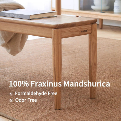 Rock Solid Fraxinus Manchurian Ash Wood Bench With Thickened Apron And Smooth Rounded Edges For Entryway Foyer Or Dining Room And Badass Heavy Duty Hallway Stool Built Tough For Everyday Chill with visible book on top.