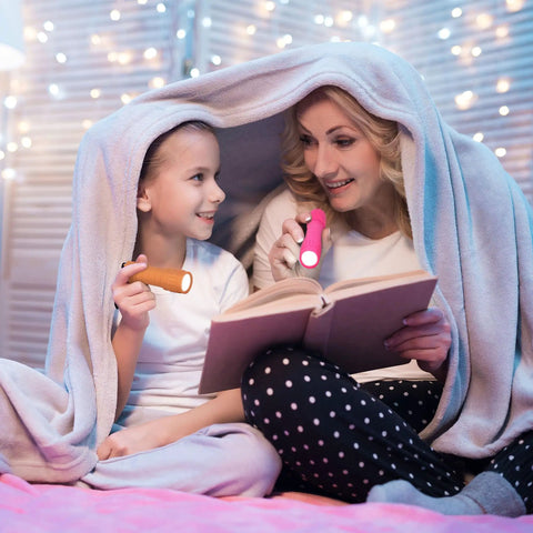 Mother and daughter reading under blanket with Six Pack Of Compact LED Flashlights With 100 Lumen Output Includes 18 AAA Batteries