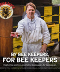 Beekeeper holding tube of Beetle Eliminator For Beekeeping Safe Long Lasting Hive Beetle Prevention For Your Apiary One 100ml Tube