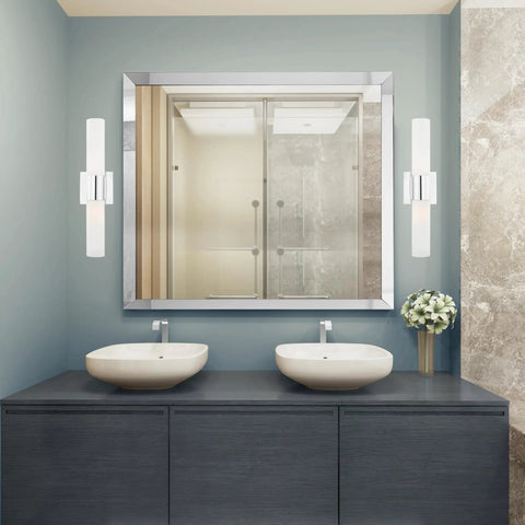 Aero 2-Light Chrome Bath Light With Modern Steel Build in bathroom setting, 4.5x18 inches, reflecting off a bathroom mirror.