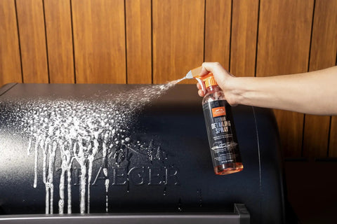 Using exterior spray from Heavy Duty Grill Cleaning Kit With Exterior Detailing Spray And Foaming Degreaser Scraper And Pad