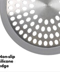 Close-up of stainless steel bathtub drain protector with hair catcher, non-slip silicone edge for quick clog prevention.