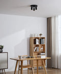 Shura Round 3-Light Black LED Ceiling Light With Rotatable Heads, Adjustable Flush Mount, in a modern living room setting