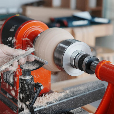 BMWOOD woodturning live tailstock chuck adapter on a lathe, silver metal, turning a light wood blank