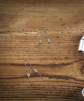 Upgrade Your Trash Can With This Heavy Duty Stainless Steel Dual Torsion Spring Kit For Smooth Automatic Lid Closure And Easy DIY Household Bin Repair With High Elasticity 4 Coil Design, two springs on wood