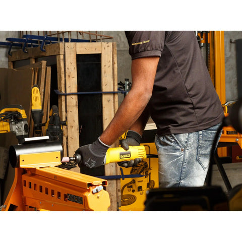 Person using Corded Die Grinder 1-1/2 Inch Wheel, 4.2 Amp, 25,000 RPM Powerhouse for metal grinding in a workshop setting.