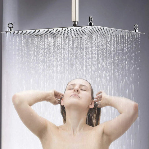 Person enjoying a luxurious shower under a 12 Inch LED Rainfall Shower Head Square Brushed Nickel High Pressure