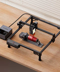 20W Laser Engraver A20 Pro V2 With Auto Air Assist And R8 Rotary Chuck on wood table, engraving cylinder object