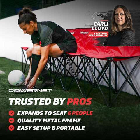 Six Seater Team Bench Folding Chair With Backpack Carry Bag For Soccer Basketball And Football Teams Portable Foldable Bench Red Ideal For Games Or Practices Easy To Set Up And Transport Durable Steel Frame in use on a soccer field