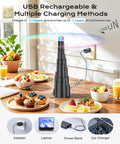 Tabletop Fly Fans With USB Type C Rechargeable Battery And Colorful LED Light Show on dining table with food, plugged in charger