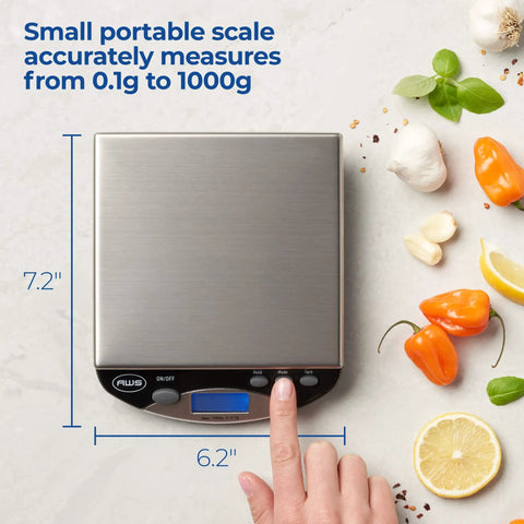 Go To Portable Precision Digital Kitchen Scale For Baking And Cooking With One Kilogram Capacity And One Tenth Gram Increments, stainless steel surface, hand adjusting settings, surrounded by vegetables