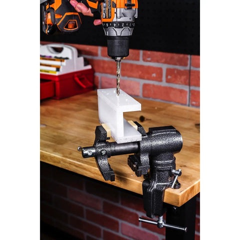Portable Clamp-On Third Hand Vise With One And A Half Inch And Two And A Half Inch Jaws That Rotates And Swivels For Jewelry Making, Hobbies And Crafts Includes Soft Jaw Covers And Clamp Or Bolt-On Mount holding a white block on a workbench