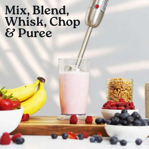 Heavy Duty 4 In 1 Immersion Blender With Whisk And Milk Frother 800W Hand Mixer blending a smoothie with fruits on the table.