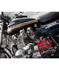 Motorcycle with attached One Quarter Inch Drive Socket Set, Six Point, Thirty Eight Piece Tool Kit for Mechanics, visible on frame.