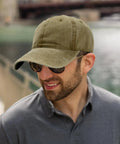 Man wearing Low Profile Adjustable Washed Cotton Baseball Cap Dad Hat for Men and Women Versatile Golf Style and Everyday Streetwear.