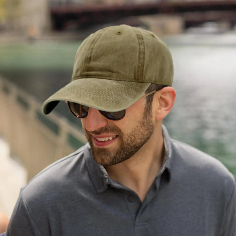 Man wearing Low Profile Adjustable Washed Cotton Baseball Cap Dad Hat for Men and Women Versatile Golf Style and Everyday Streetwear.