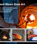 Artisan hand blowing glass, crafting ice cream shaped spiral hummingbird feeder for outdoors, showing colorful glass and furnace.
