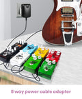Guitar Pedal Power Supply 9V 1A DC Center Negative For Multi Pedal Boards, 100-240V AC Input powering multiple pedals and guitar.