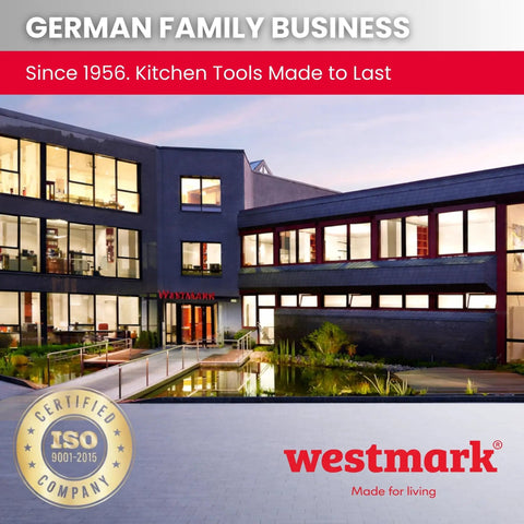 Westmark company building exterior with modern architecture and pond, featuring Westmark logo and ISO certification badge.
