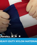 Hands holding Premium 3X5 Outdoor American Flag Made in USA With Embroidered Stars And Sewn Stripes, showing heavy-duty nylon material.