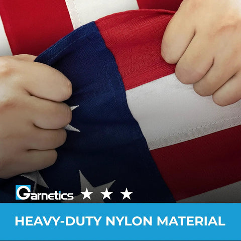 Hands holding Premium 3X5 Outdoor American Flag Made in USA With Embroidered Stars And Sewn Stripes, showing heavy-duty nylon material.