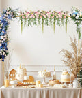 Badass Heavy Duty Over The Table Rod Stand For Balloons And Props with floral decor and desserts displayed on a table.