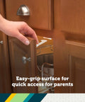 Bulletproof Spring Loaded Cabinet And Drawer Latches 10 Pack White Baby Proofing Essentials For Sneaky Toddlers Easy grip usage shown on cabinet door.