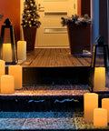 Waterproof Outdoor Flameless Pillar Candles 10x5 Inch Battery Operated LED With Remote And Timer Flickering Ivory White on steps