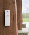Wireless Outdoor Temperature and Humidity Sensor With Wall Mount Weather Resistant Gauge installed on wooden exterior surface